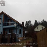 Покраска деревянного дома в голубой цвет